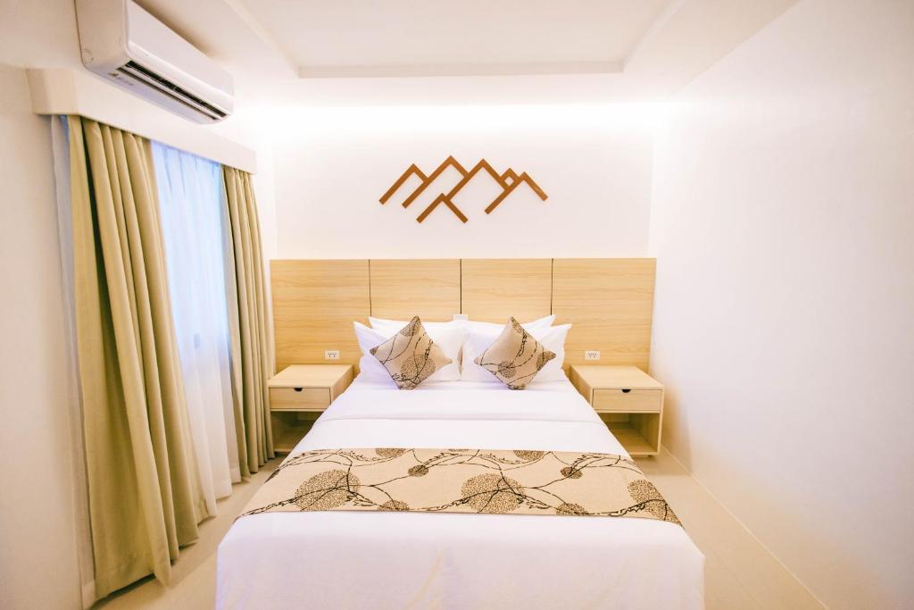 Postel nebo postele na pokoji v ubytování Panglao Vista Suites by SMS Hospitality