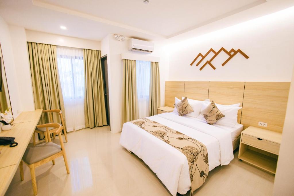 Postel nebo postele na pokoji v ubytování Panglao Vista Suites by SMS Hospitality