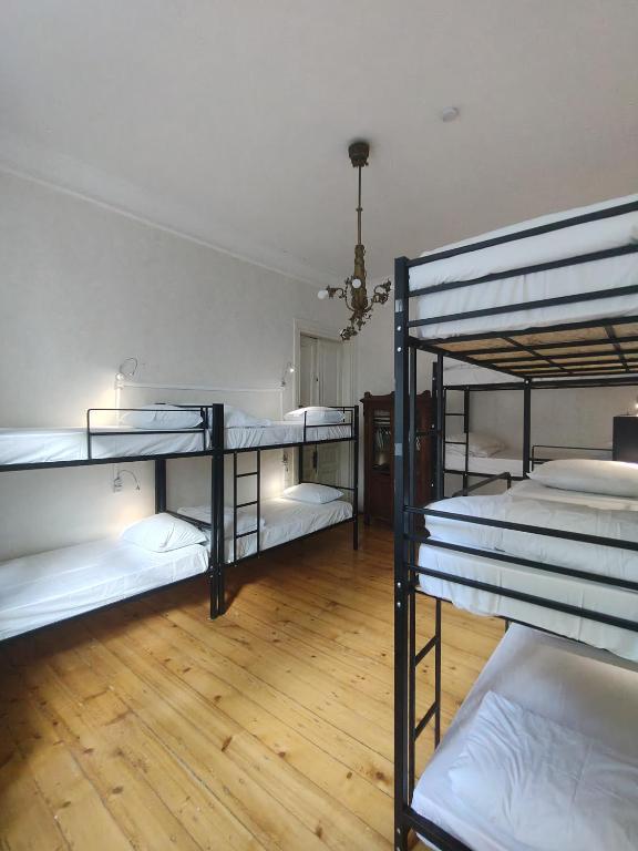 Postel nebo postele na pokoji v ubytování Ambience Hostel & Apartments
