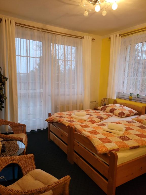 Postel nebo postele na pokoji v ubytování Pension Pastis