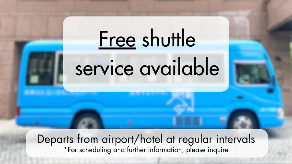 a blue van with the words free shuttle service available at Toyoko Inn Chubu International Airport No1 in Tokoname