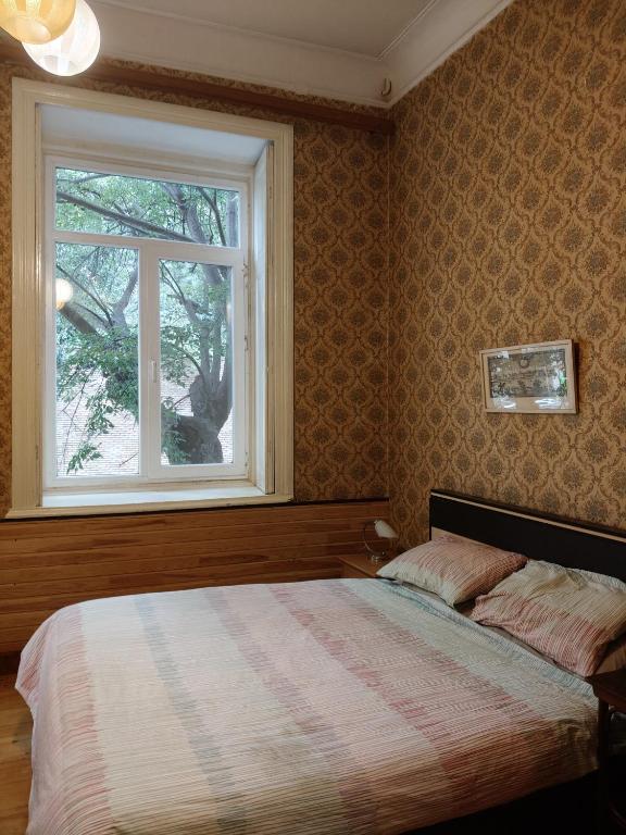 Postel nebo postele na pokoji v ubytování Ambience Hostel & Apartments