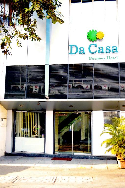 a building with a sign on the side of it at Da Casa Business Hotel in Pune