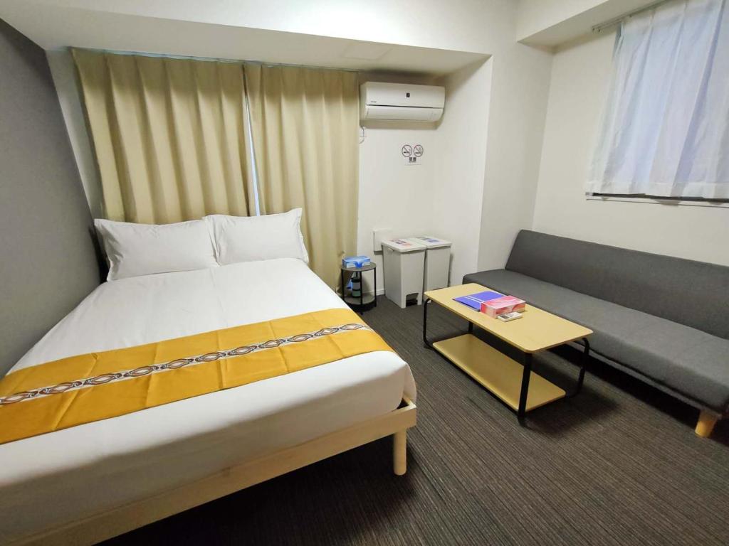 Postel nebo postele na pokoji v ubytování incense上野根岸201