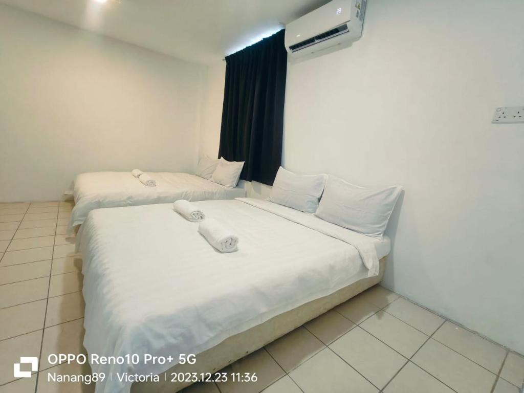 Postel nebo postele na pokoji v ubytování Hotel Seroja