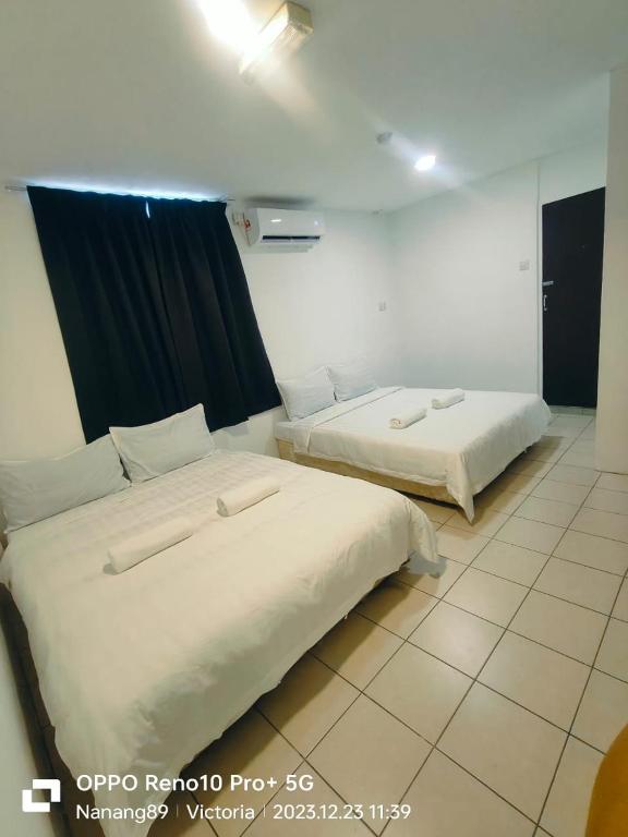 Postel nebo postele na pokoji v ubytování Hotel Seroja