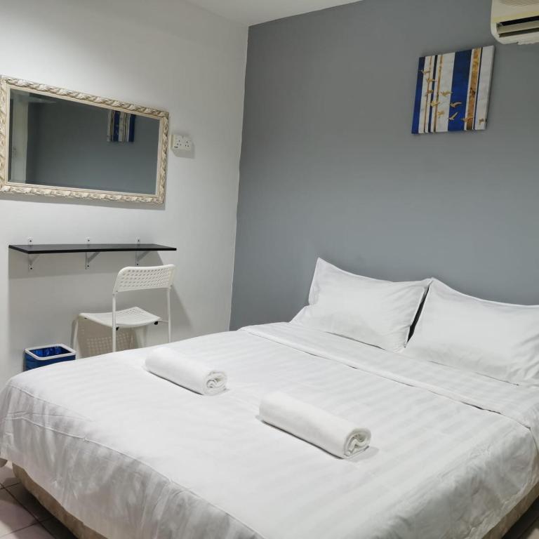 Postel nebo postele na pokoji v ubytování Hotel Seroja