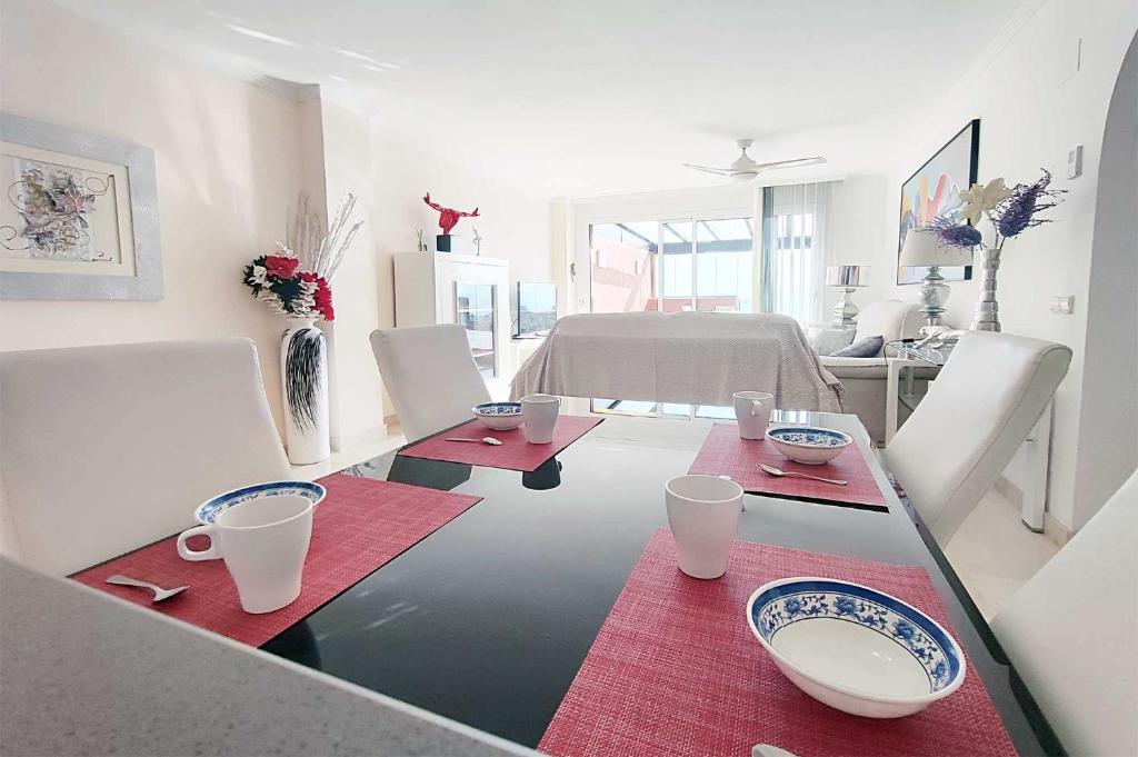 Televízia a/alebo spoločenská miestnosť v ubytovaní Penthouse Patio de doña Julia