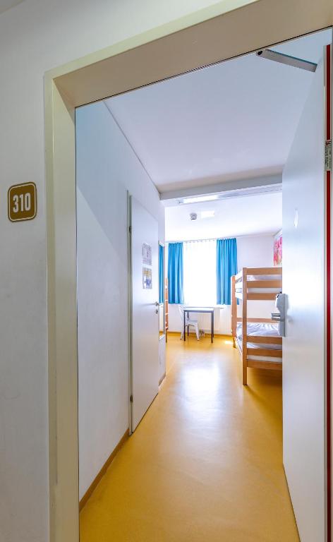 Postel nebo postele na pokoji v ubytování A&T Hotel & Hostel