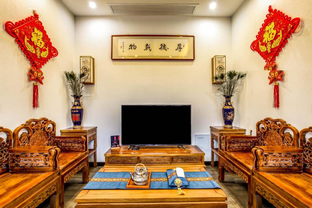 TV a/nebo společenská místnost v ubytování Pingyao Ziwenge Inn
