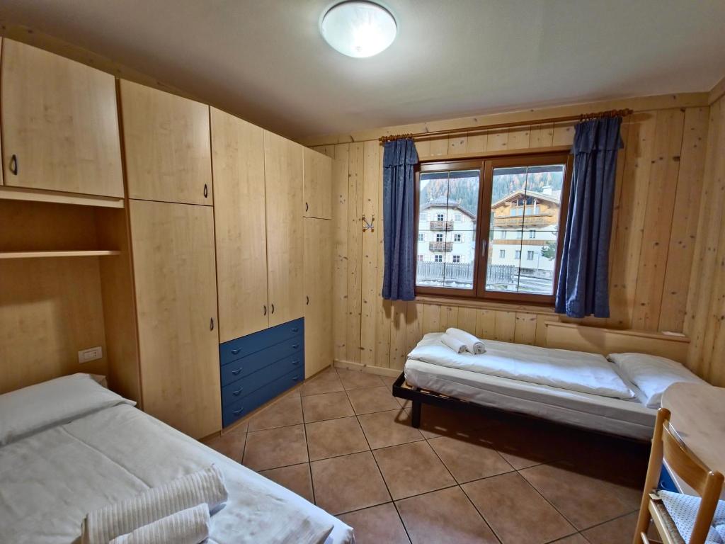 Voodi või voodid majutusasutuse Chalet Larsech by AMA Val di Fassa toas