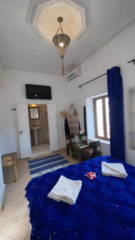 Postel nebo postele na pokoji v ubytování Riad Morocco Sky