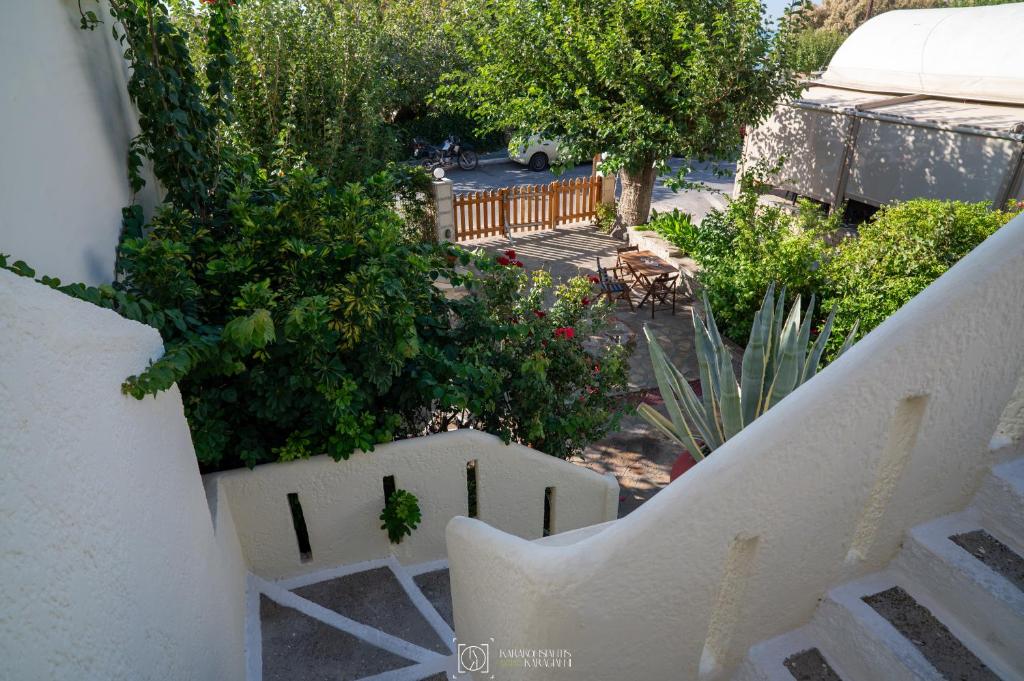 an overhead view of a garden with bushes and trees at Elli Studios & Apartments in Marathokampos