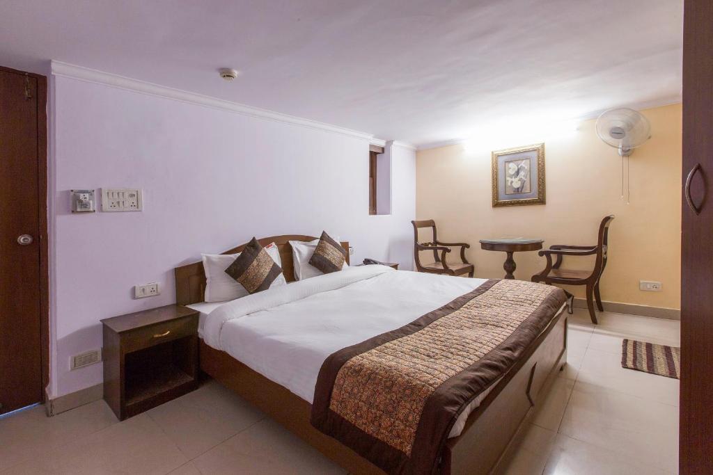 Postel nebo postele na pokoji v ubytování Hotel O Hotel Landmark Inn