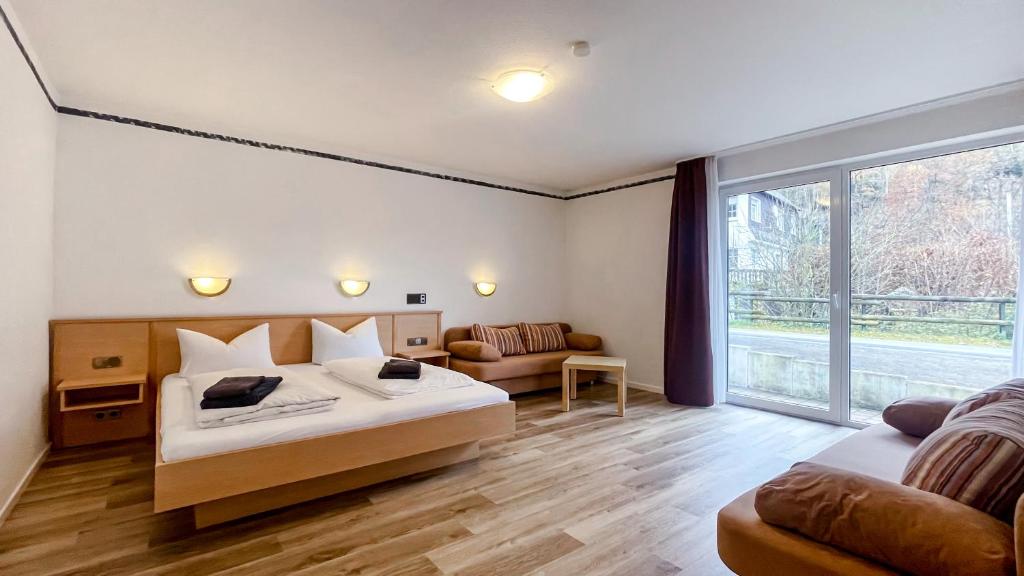 a bedroom with a bed and a large window at Smart Resorts B&B2 BB2 308 in Winterberg