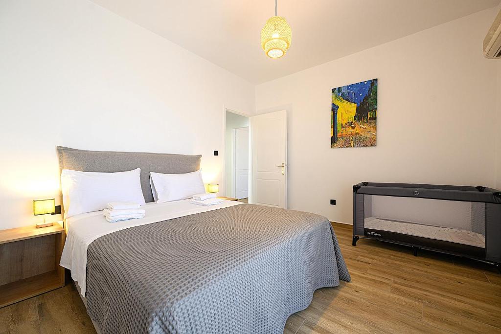 Postel nebo postele na pokoji v ubytování Alexander Apartments Airport