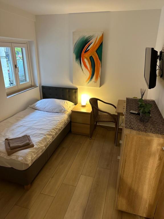 Postel nebo postele na pokoji v ubytování Hotel Kreuz Renchen