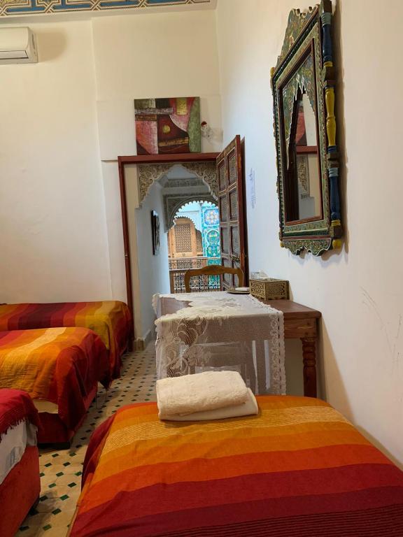 Postel nebo postele na pokoji v ubytování Riad Ouliya