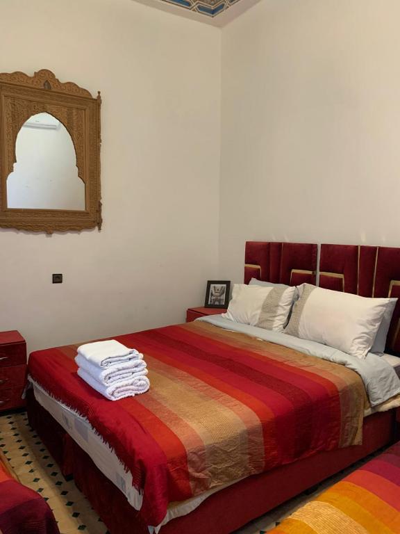 Postel nebo postele na pokoji v ubytování Riad Ouliya