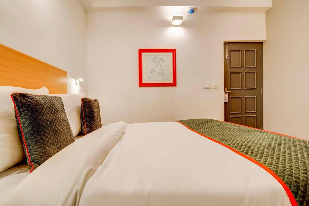 Postel nebo postele na pokoji v ubytování Hotel O Star Key
