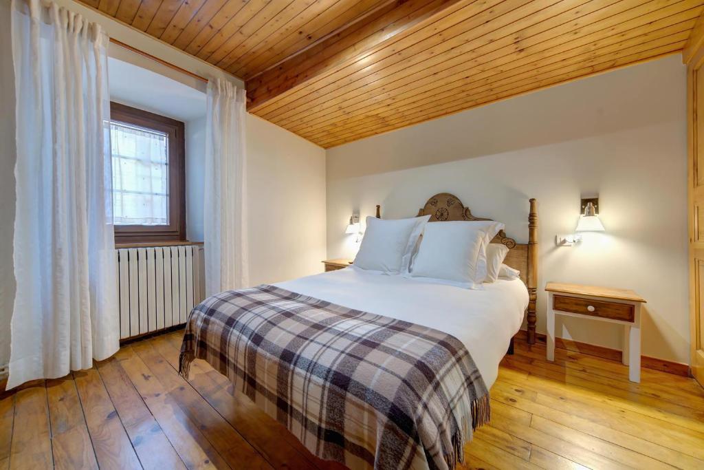 Postel nebo postele na pokoji v ubytování Casa Jansú