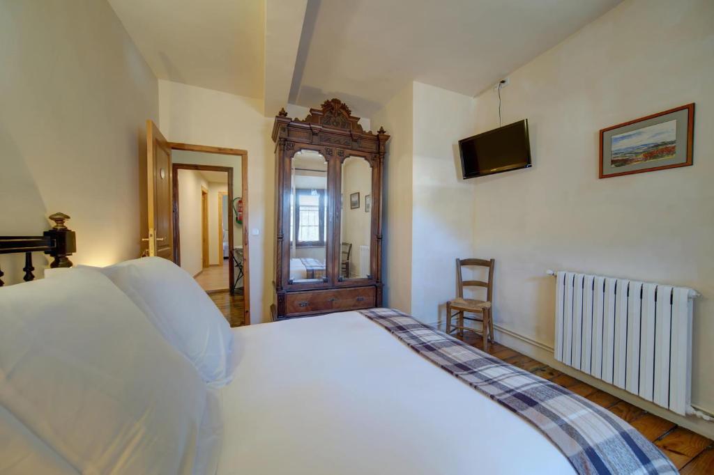 Postel nebo postele na pokoji v ubytování Casa Jansú