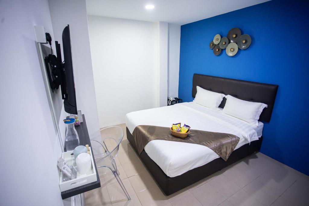 Postel nebo postele na pokoji v ubytování Rex City Hotel