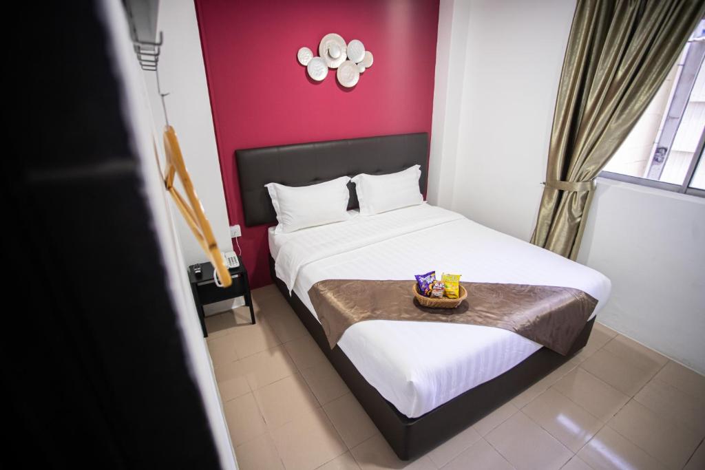 Postel nebo postele na pokoji v ubytování Rex City Hotel