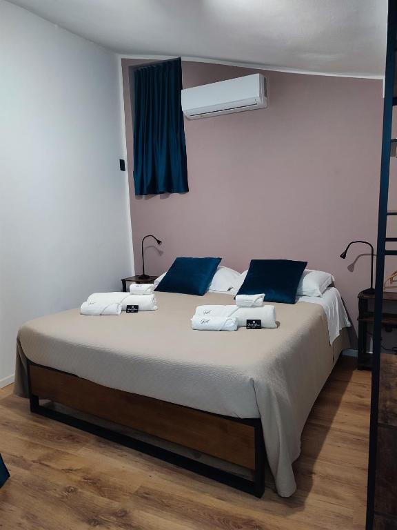 Postel nebo postele na pokoji v ubytování Guest House alla Scala
