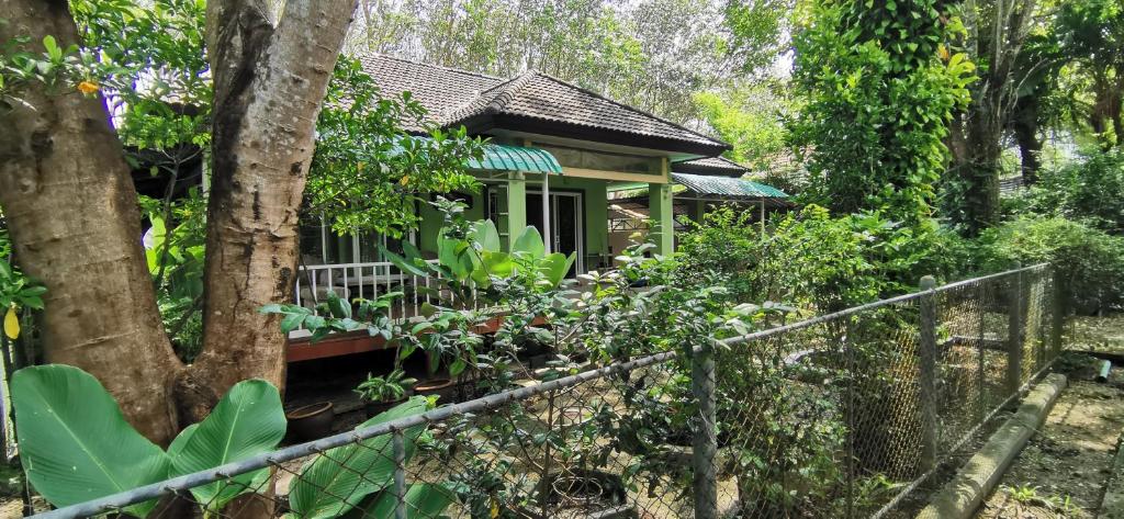 a small house in the middle of a forest at Bassara House 2 bedroom in Koh Lone