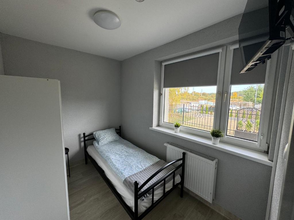 Postel nebo postele na pokoji v ubytování PGK Hostel Gryfino