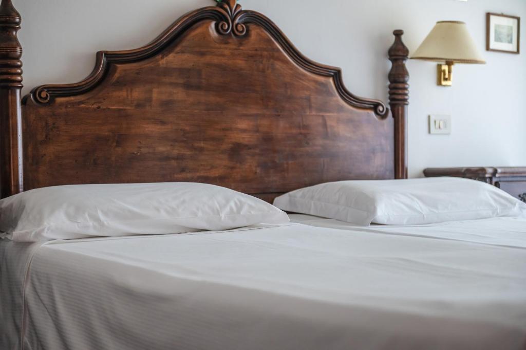 Postel nebo postele na pokoji v ubytování Agora Park Hotel