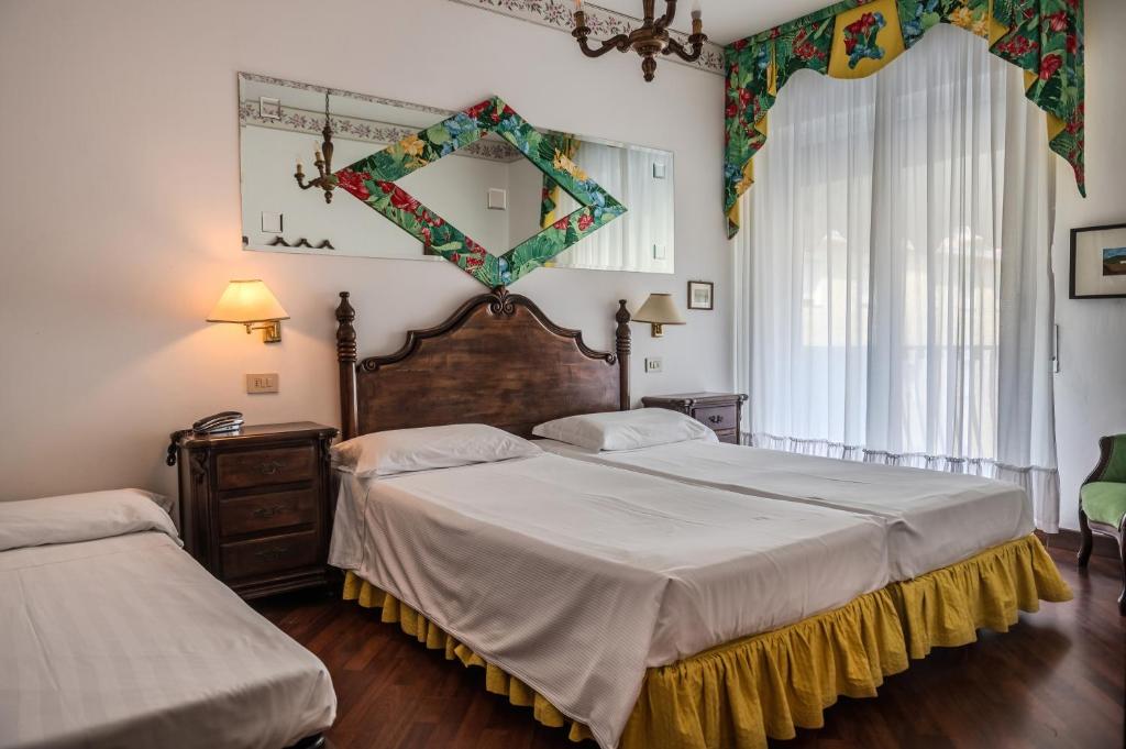 Postel nebo postele na pokoji v ubytování Agora Park Hotel