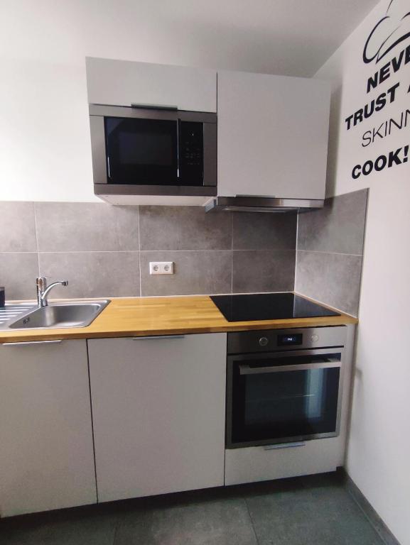 Kuchyň nebo kuchyňský kout v ubytování Ferienwohnung Scheib Aspach