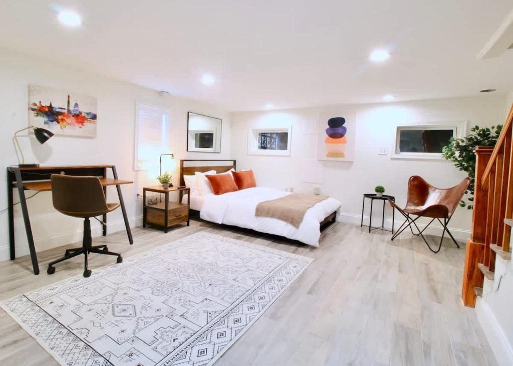 a bedroom with a bed and a desk at Studio Apartment near RFK fields in Washington, D.C.
