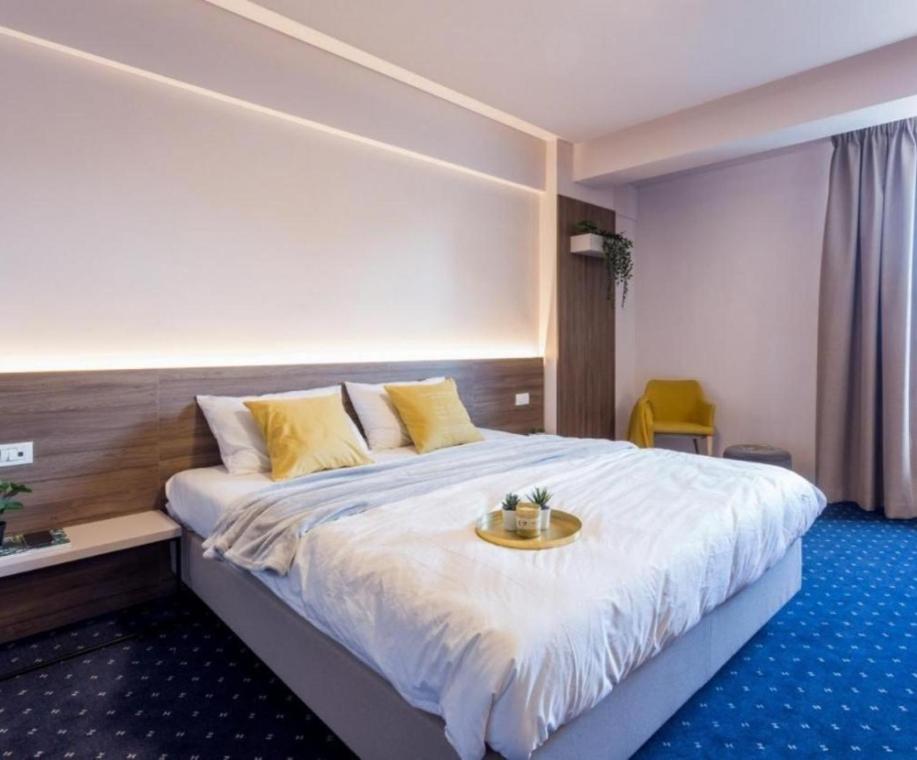 Postel nebo postele na pokoji v ubytování Kepler Residence