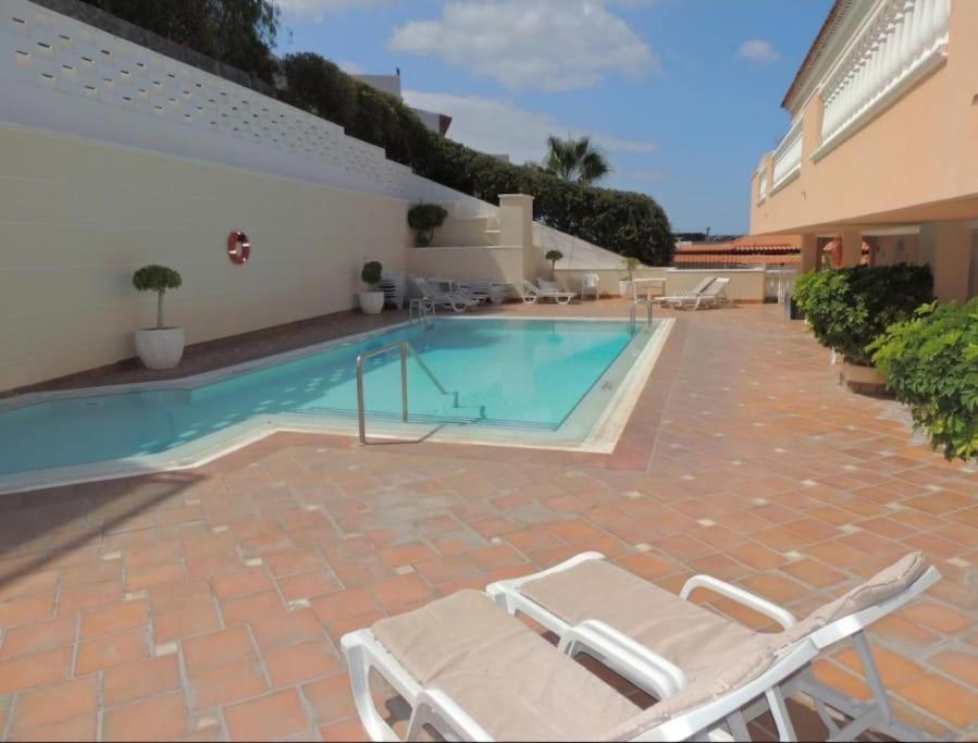 The swimming pool at or close to Perfect Getaway in Los Gigantes, Shared Pool-WiFi