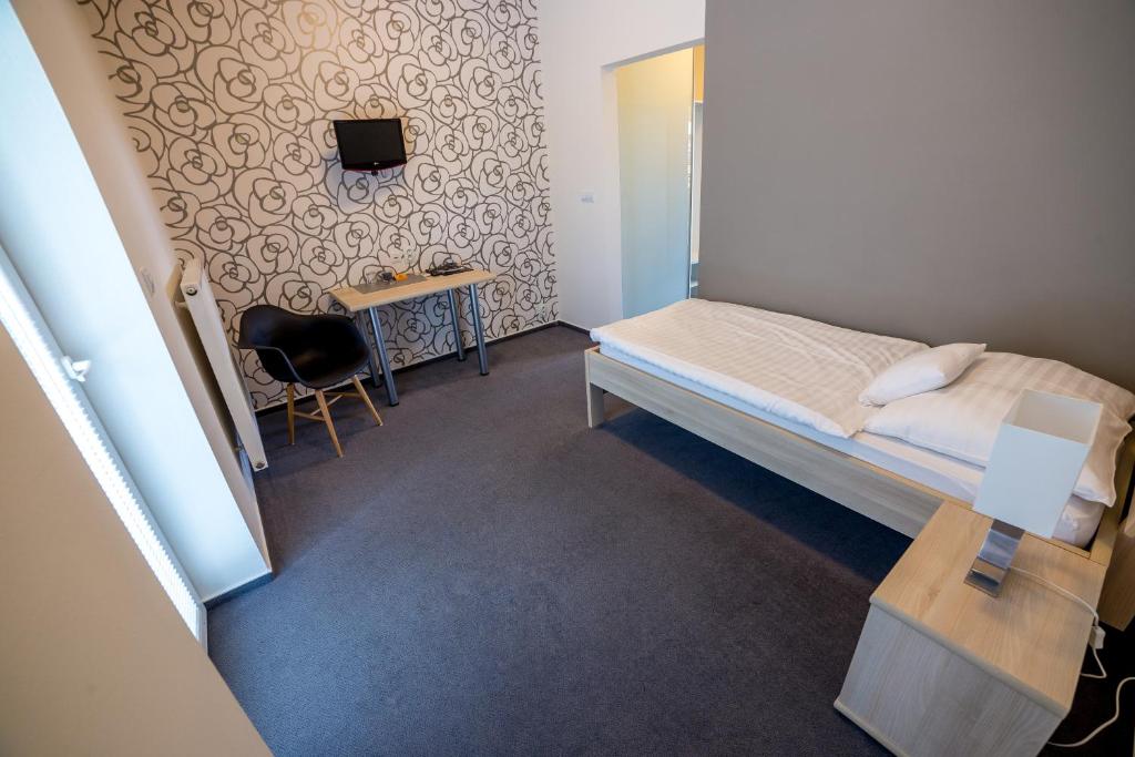 Postel nebo postele na pokoji v ubytování Hotel Lion