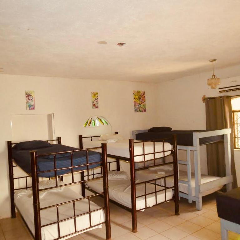 Postel nebo postele na pokoji v ubytování Cabañitas y Dorms