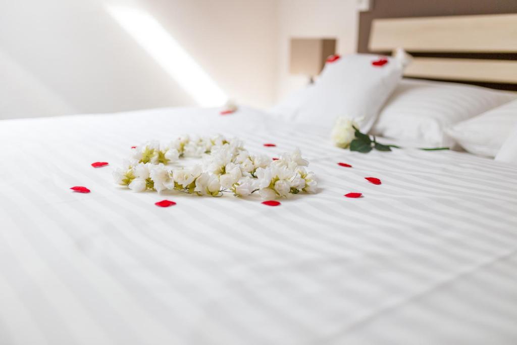 Postel nebo postele na pokoji v ubytování Hotel Lion