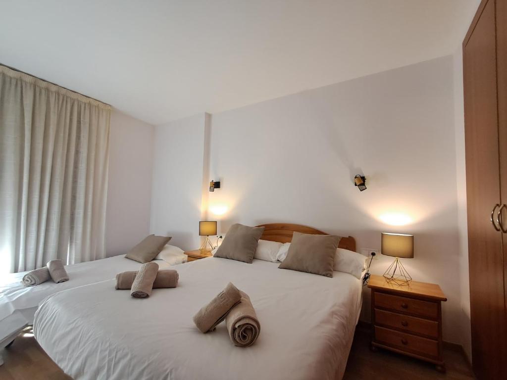 Postel nebo postele na pokoji v ubytování PROBER_TERRASSES DEL TARTER