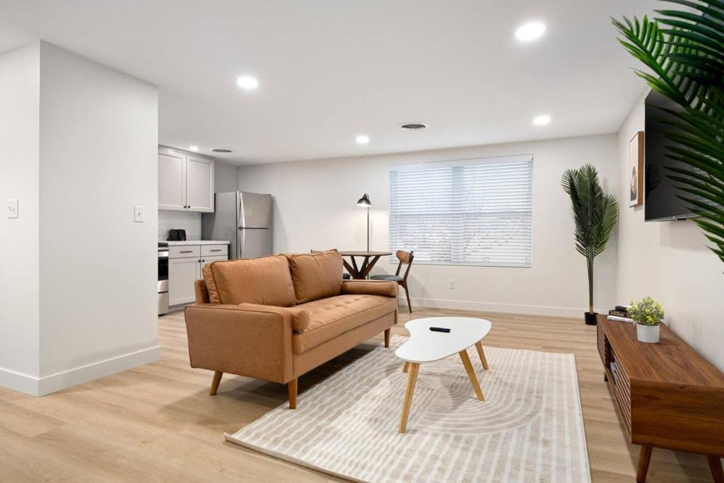 a living room with a couch and a table at The Silo 6 - 1BD Modern Abode in Morton