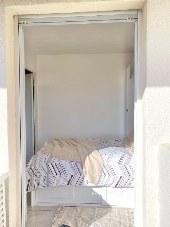 Ένα ή περισσότερα κρεβάτια σε δωμάτιο στο Appartement vue exceptionnelle