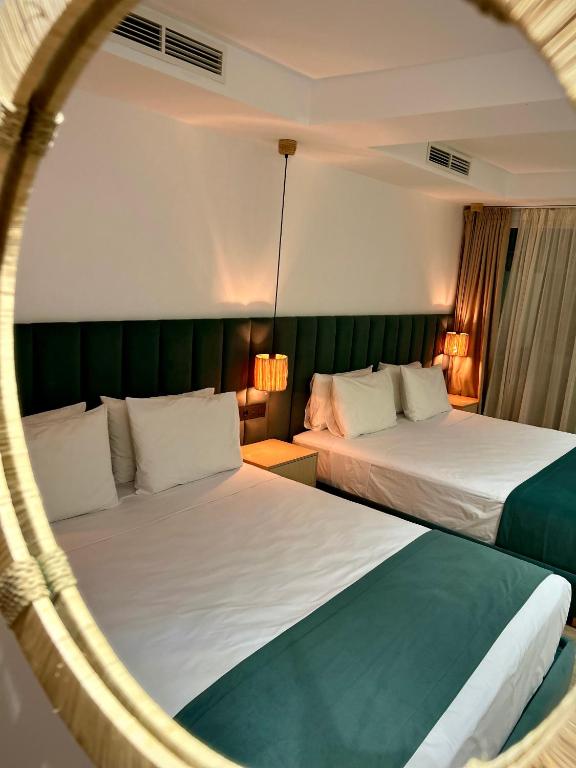 Postel nebo postele na pokoji v ubytování Tanger Miramonte - Resort Seaside Suites & Double Rooms
