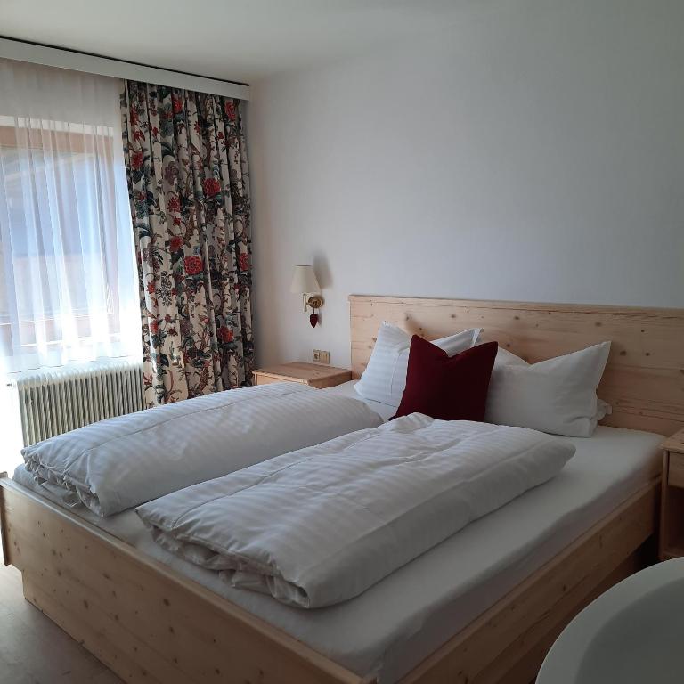 Postel nebo postele na pokoji v ubytování Haus Gmahblick Ferienwonungen