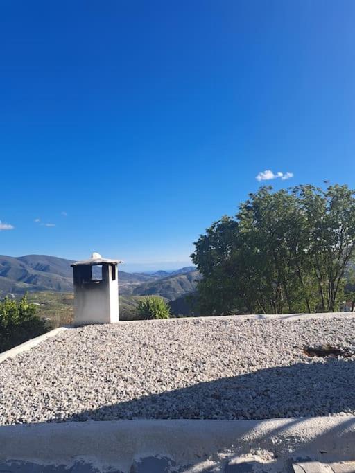 a building sitting on top of a pile of gravel at Paraje del Almendral- Casa Grande in Lanjarón