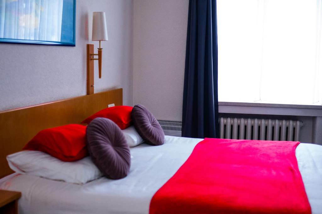 Postel nebo postele na pokoji v ubytování Hotel Professor Leuven Centrum