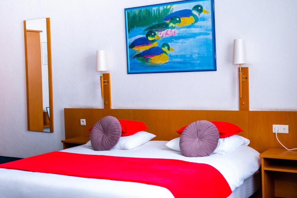 Postel nebo postele na pokoji v ubytování Hotel Professor Leuven Centrum