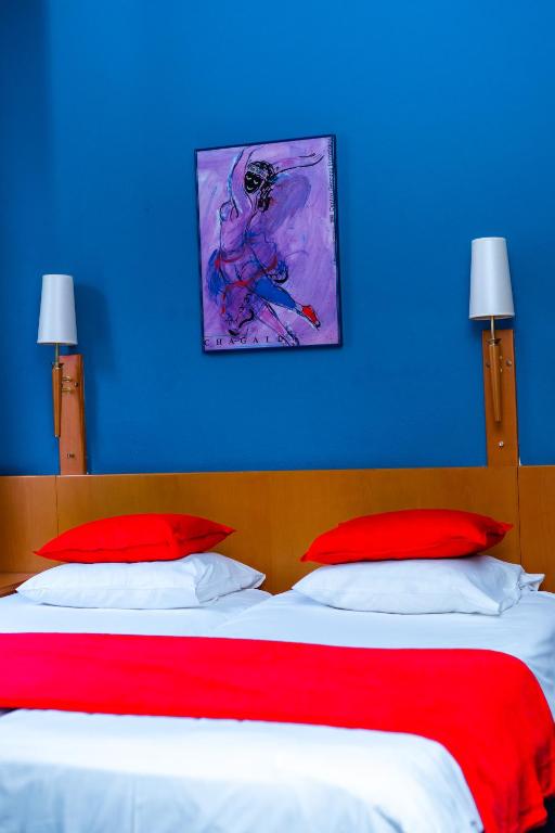 Postel nebo postele na pokoji v ubytování Hotel Professor Leuven Centrum