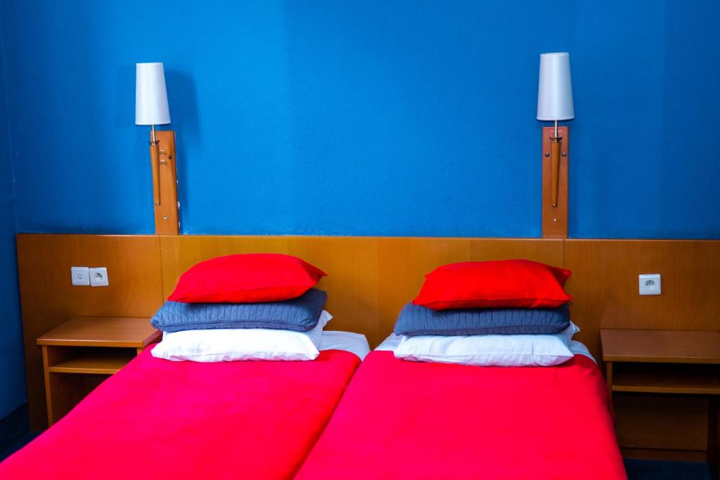 Postel nebo postele na pokoji v ubytování Hotel Professor Leuven Centrum